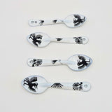 set of four bird-like creatures (nahual) with long beaks and distinctive features on the enamelware peltre metal spoon