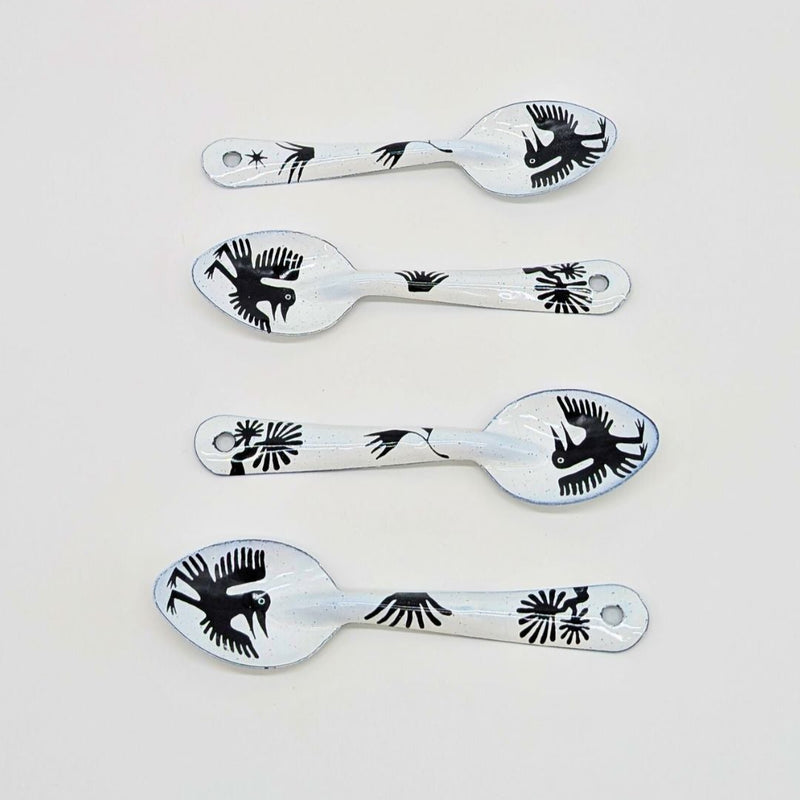 set of four bird-like creatures (nahual) with long beaks and distinctive features on the enamelware peltre metal spoon
