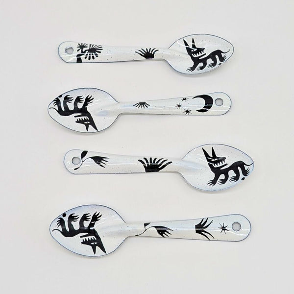 set of four stylized dog or wolf-like creature (nahual) with sharp teeth and distinctive features on the enamelware peltre metal spoon