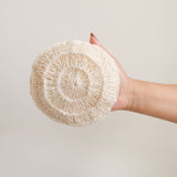 Large Agave Body Sponge stuffed with natural plant fibers with handle being held by a hand