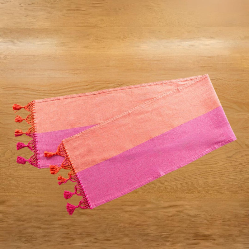 Color Block Pink and Orange Cotton Table Runner folded on wood table