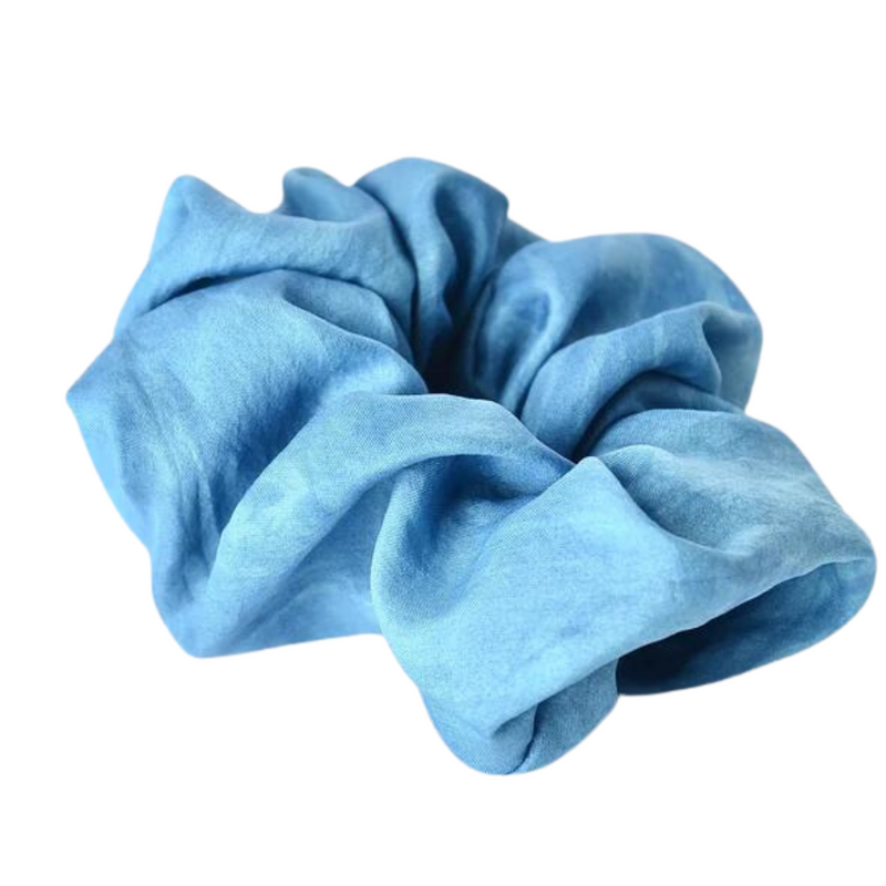 Light blue silk scrunchie handmade and dyed with natural dyes from indigo plant by a Oaxacan artist.