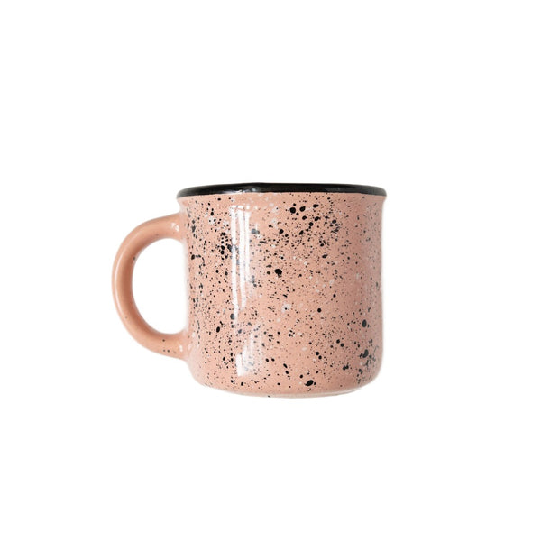 Side view of Light Pink Speckled Ceramic Coffee Mug (Mexican peltre style) with Black Rim on white background
