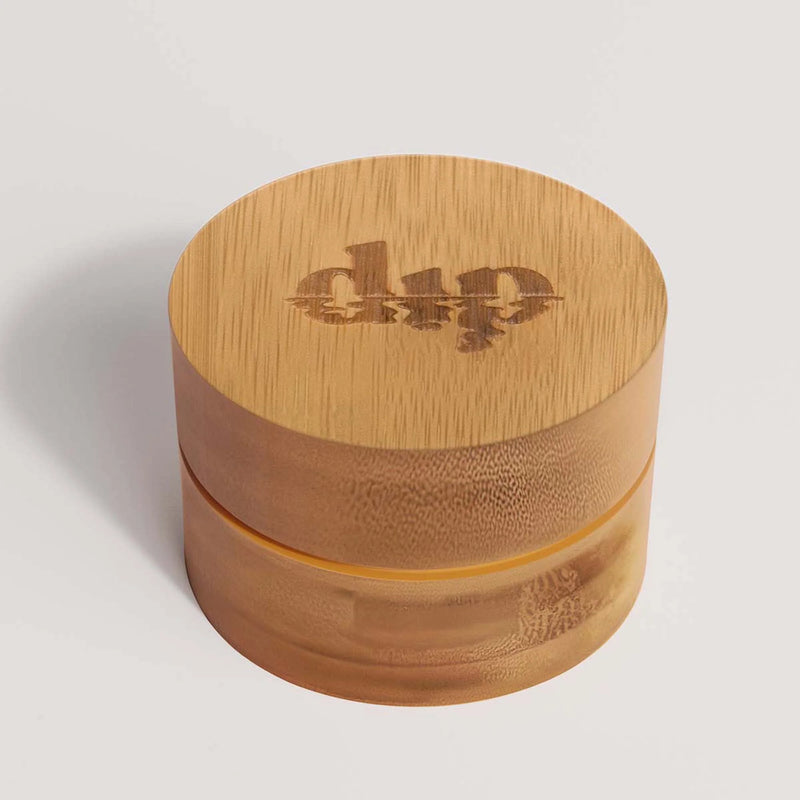 Eco-friendly bamboo travel case with a lined lid and inner coaster, designed to protect and dry a mini sized bar during travel.