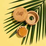 Mini Bamboo Travel Case with Coaster, featuring a mini conditioner bar neatly placed inside. The compact bamboo case includes a lined lid and an inner coaster with tiny feet, designed to protect the bar and keep it dry during travel. Ideal for eco-conscious travelers on short trips.