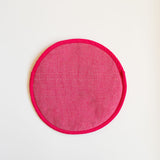 A vibrant Rosa Mexicano pink color block handwoven cotton tortilla warmer, perfect for keeping tortillas warm while adding a pop of color to your table. This eco-friendly, artisan-made kitchen accessory is crafted from sustainable materials, reflecting Mexican cultural heritage and zero-waste values.