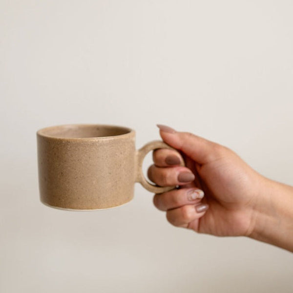 Large Handle Ceramic Stoneware Mexican Mug - Brown / Nuez / beige color held by a hand