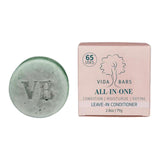 Vida Bars Leave-In Conditioner bar placed next to its eco-friendly packaging, showcasing the product's handcrafted design and natural appeal. The bar is presented against a clean background, highlighting its sustainable, zero-waste packaging and the unique texture of the conditioner.