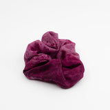 Magenta silk scrunchie handmade and dyed with natural dyes made by a Oaxacan artist.