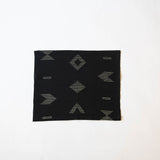 Handwoven Cotton Placemat or Dinner Napkin in Black fabric with white geometric patterns on a white background