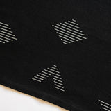Handwoven Cotton Placemat or Dinner Napkin in Black fabric with white geometric patterns on a white background