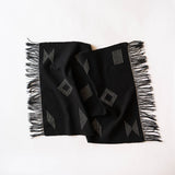 Handwoven Cotton Black hand and dish towel with geometric patterns and fringes on a white background