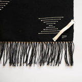 Handwoven Cotton Black hand and dish towel with geometric patterns and fringes on a white background