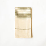 A folded beige linen kitchen hand towel with dark olive green woven stripes, shown against a plain white background.
