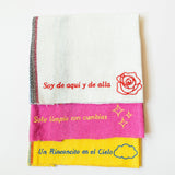 Jerga Cotton textile (also known as a trapito) with colorful design and embroidered text on a white background