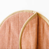 Close up of cinnamon and beige cotton tortilla warming pouch