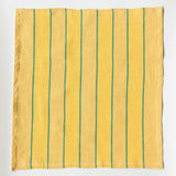 full yellow textile with vertical green stripes laid flat against a white background, displaying the complete weave pattern and texture of this handwoven piece.