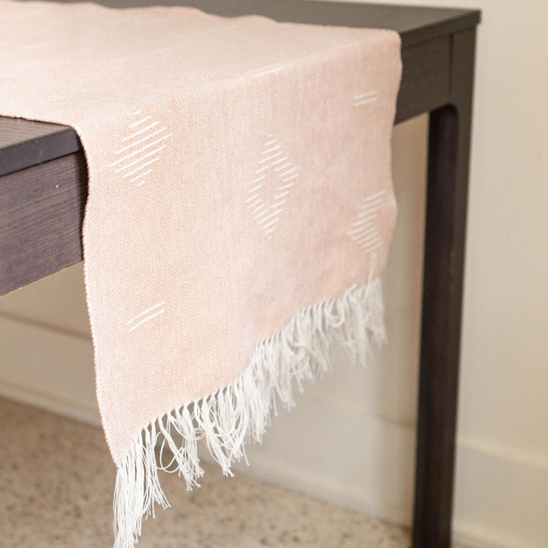 Handwoven Cotton Table Runner with fringe on wood table