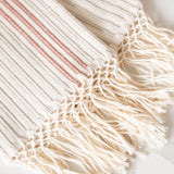 A close-up of a Corded Handwoven Cotton Hand & Tea Towel with three cinnamon stripes 