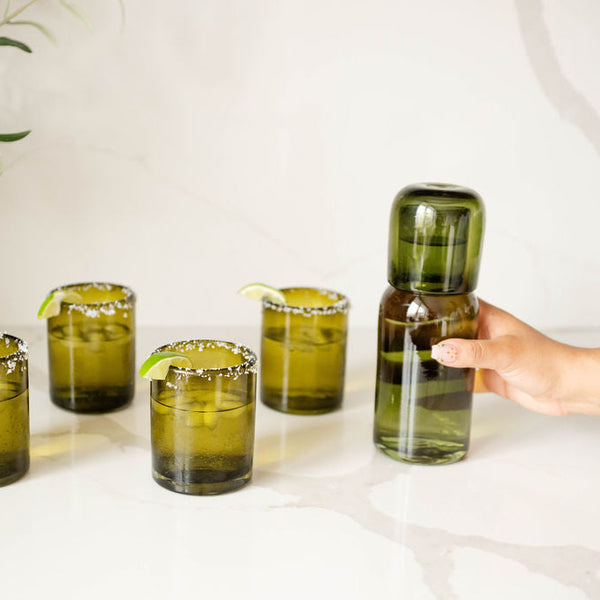 Handblown Glass Bedside Carafe in Olive Green with a lid pictured with olive green glass cups