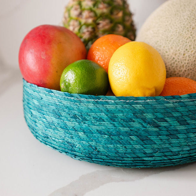 Sustainable Eco-friendly Palm Fruit Basket (Frutero) - green styled with fruit on a marble countertop.