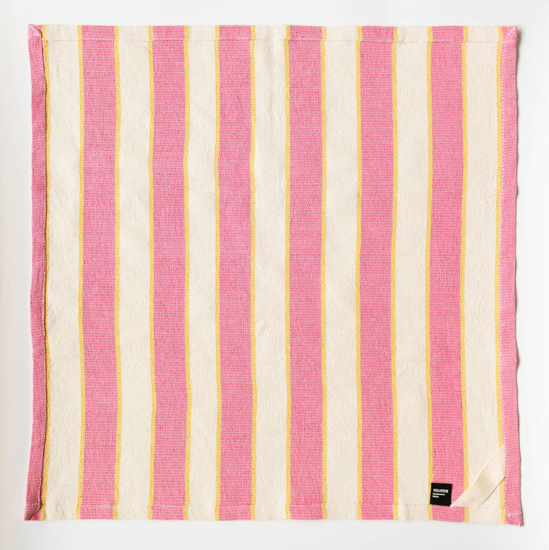 full pink and white striped textile laid flat, featuring vertical pink stripes alternating with white stripes, all bordered by thin yellow lines. The black "VOLVERDE" label is visible in the bottom right corner.