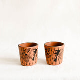 Peach Ceramic cups with floral design on a white background