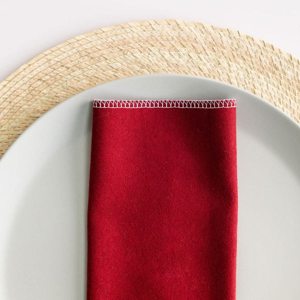 Red cotton flannel cloth napkin on a gray plate