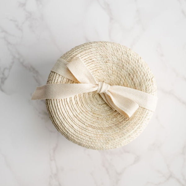 Artisanal, handwoven palm gift basket for a zero-waste gift. 