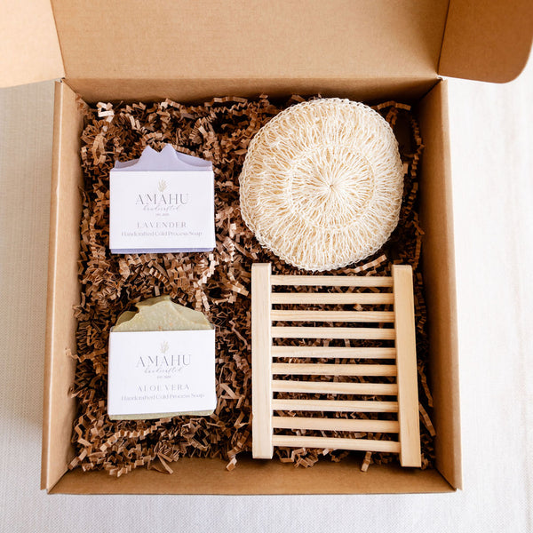 Zero Waste Gift Set wrapped in a box with two Amahu Soap Bars, Agave Body Sponge and wood soap dish
