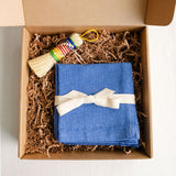 Rainbow escobeta (Mexican agave fiber dish brush) with blue handwoven cotton napkins. Two artisanal pieces that represent our family's traditions: an escobeta, a traditional Mexican dish brush made from sustainably-sourced agave fibers, and a set handwoven napkins sourced from 100% Mexican cotton. Both are timeless, sustainable pieces that remind us of our abuelita's house. This is the perfect housewarming gift or for the special person in your life that appreciates artisanally crafted home goods.