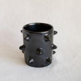 Handcrafted Spiked Black Clay Cup made from authentic Mexican black clay (barro negro), featuring a bold spiked design with a smooth black metallic finish. Perfect for modern drinkware or as a unique artisanal decor piece