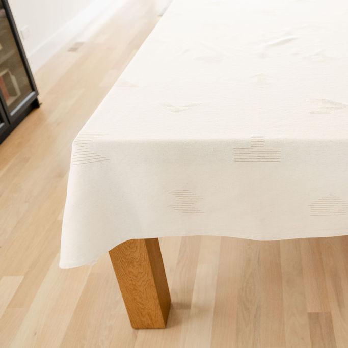 Beige and gold cotton tablecloth with geometric designs