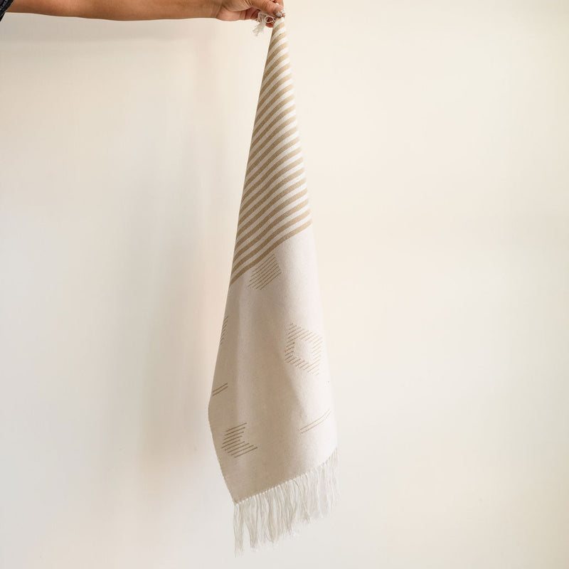 Handwoven Cotton Tea Towel and Hand Towel in Beige Stripes and Geometric Lines with Fringe held by a hand