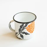 White enamel (Peltre) Cup with vibrant orange marigold (cempasúchil) designs and black leaf accents, set against a white background.