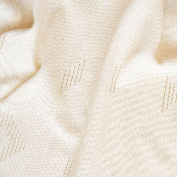 Closeup of Teia Handwoven Cotton Tablecloth in a beige neutral color featuring intricate geometric designs, crafted by artisans in Oaxaca. Perfect for adding a touch of elegance and tradition to your dining space. Sustainable and made from 100% Mexican cotton. Ideal for modern and rustic decor styles.