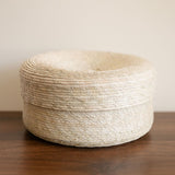 Round Palm Tortilla Warming Basket (tortillero) with Lid resting on a table