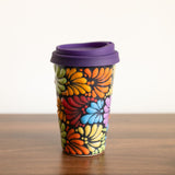 A vibrant, hand-painted Talavera Ceramic Coffee Tumbler featuring intricate, traditional Mexican designs in bold, fade-resistant colors. Perfect for enjoying hot or cold drinks, this artisan-crafted tumbler from Puebla adds a touch of Mexican heritage to your sustainable kitchenware collection.