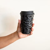 Black Ceramic Talavera Tumbler with Black lid held by hand