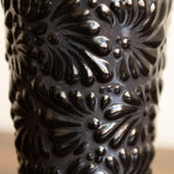 Closeup of black hand-painted Talavera Ceramic Coffee Tumbler featuring intricate, traditional Mexican designs in bold, fade-resistant colors. Perfect for enjoying hot or cold drinks, this artisan-crafted tumbler from Puebla adds a touch of Mexican heritage to your sustainable kitchenware collection.