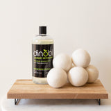 The perfect gift for a new baby. This sustainable, plant-based laundry kit for sensitive skin features Dinobi natural laundry made for precious skin and a set of 6 large wool dryer balls.