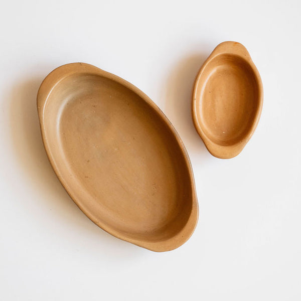 Two Mexican terracotta ceramic bowls on a white background