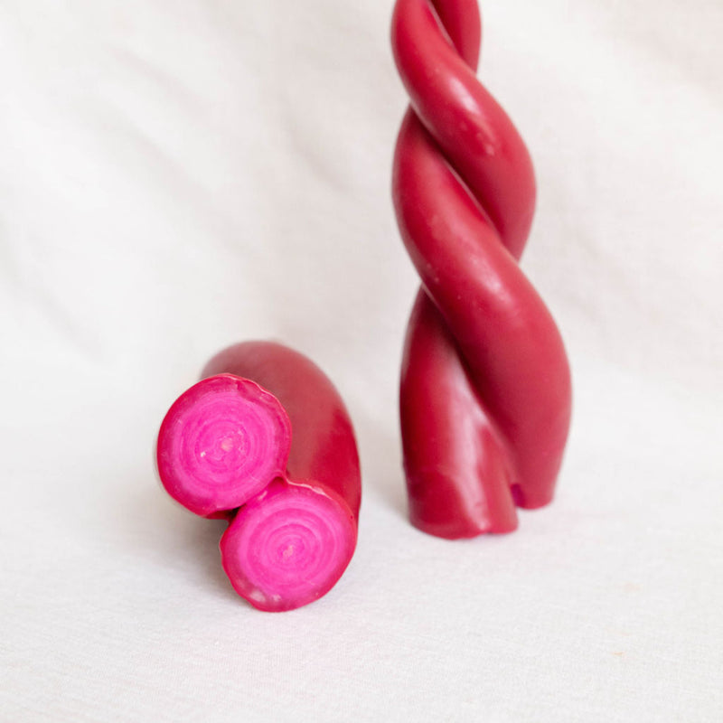 Artisanal double spiral beeswax taper candle in Rosa Mexicano (Fuschia) bottom view