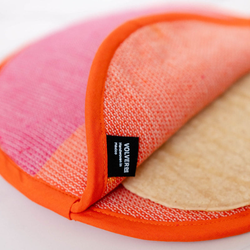 Pink and orange cloth tortilla warmer with tortilla inside