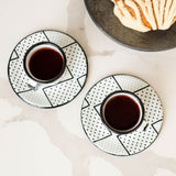enamel espresso set with saucer and coffee and a concha