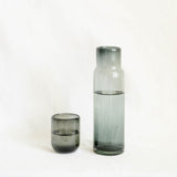 Black / Grey handblown glass carafe and matching cup with water inside