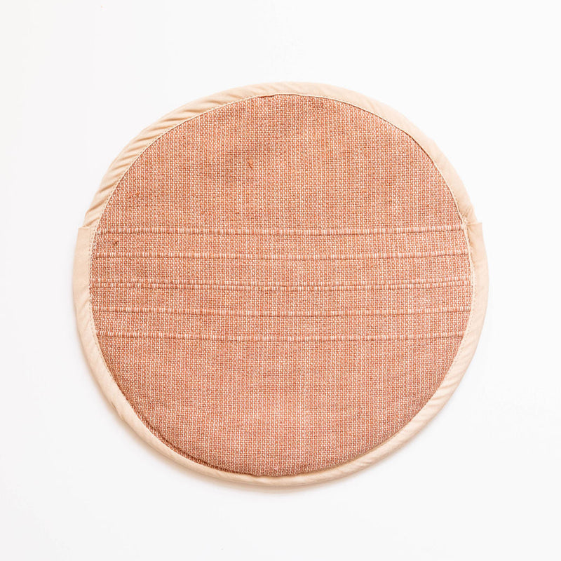 Round cotton woven tortilla warmer in cinnamon color on a white background