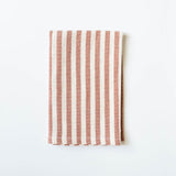 Striped fabric with cinnamon brown and white pattern on a white background