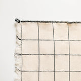 Plaid napkin with black and white pattern on a white background