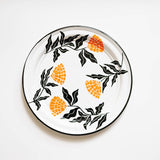 Enamel Peltre serving platter in white with delicate orange floral accents inspired by the cempasúchil flower. The platter features a smooth, glossy finish and a slightly raised edges for easy carrying, perfect for serving snacks, or as a decorative centerpiece.